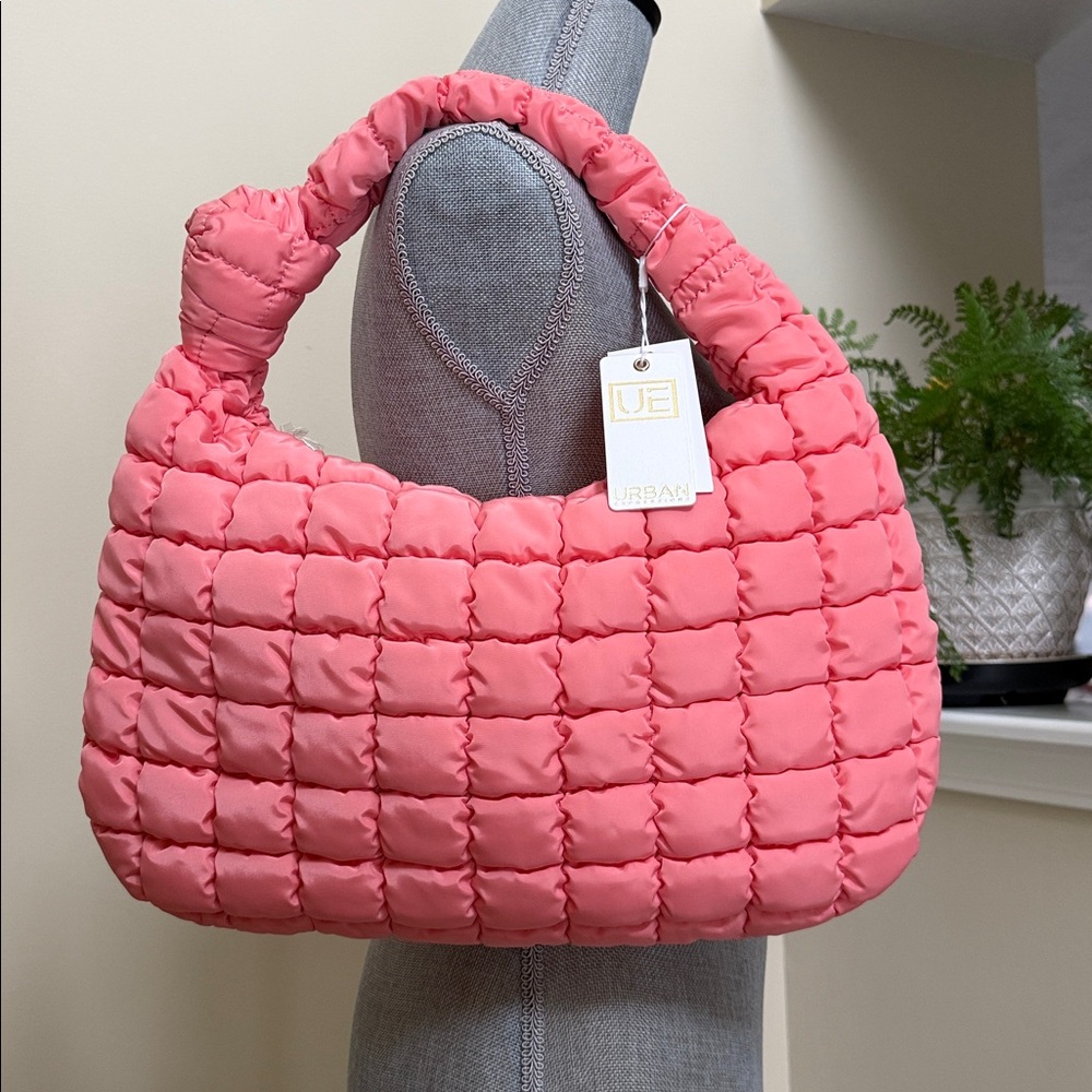 Urban Expressions Vibrant salmon colored quilted puffer shoulder bag.